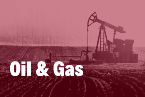 Oil and Gas in white bold text over an image of an oil pump